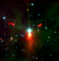 This image taken by the Spitzer Space Telescope shows two low-mass stars in the rectangles that show tails in the 24 Micron filter image. This is seen as signs that Meissa is photoevaporating the disks of these low-mass stars.[19]