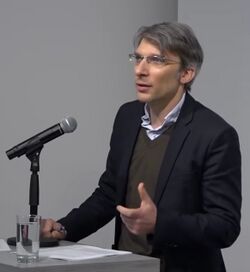 Armen Avanessian speaks at "Images of Surveillance" at the Goethe Institut New York in 2016