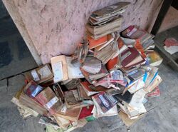 Stacks of water-damaged books