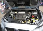 Open engine compartment of a Subaru WRX, showing the horizontally-opposed "boxer" engine coded "FA20F"