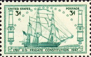 A postage stamp accurately depicts Constitution at sail. The ship sails to the right side of the stamp.