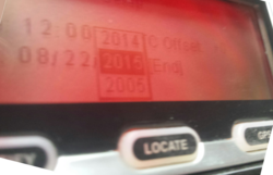 A red-backlit LCD screen above three labelled rubber buttons shows a dropdown selector for dates.