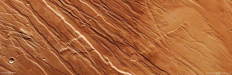 File:Faults and scars near Tharsis province on Mars ESA22013931.jpeg