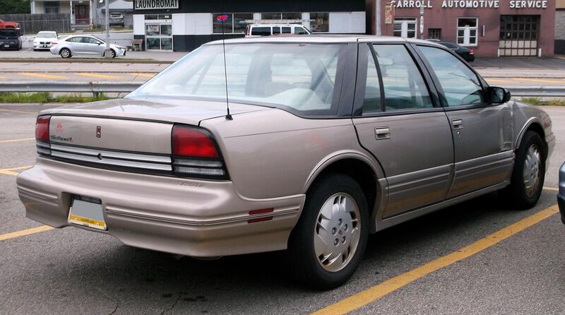 File:1997 Oldsmobile Cutlass Supreme SL in Light Sandrift Metallic, rear right, 07-24-2022.jpg