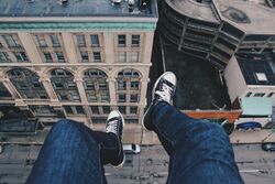 Feet dangling from a building (Unsplash).jpg
