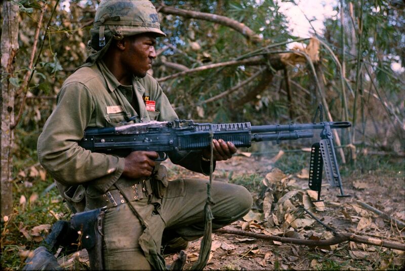 File:NARA 111-CCV-345-CC37981 25th Infantry Division soldier spraying tree line with M60 fire Operation Cedar Falls 1967.jpg