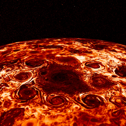 Cyclone storms encircle Jupiter's North Pole, captured in infrared light by NASA's Juno spacecraft.png