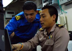 US Navy 090817-N-5207L-080 Naval liaison officers from Malaysia and Thailand coordinate efforts aboard the amphibious dock landing ship USS Harpers Ferry (LSD 49).jpg