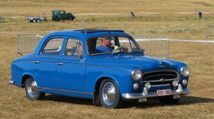 Peugeot 403 featuring the anti-pedestrian bonnet badge fitted on earlier versions.jpg