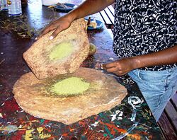 Aboriginal grain grinding. Uluru, (Ayers Rock), Australia.jpg