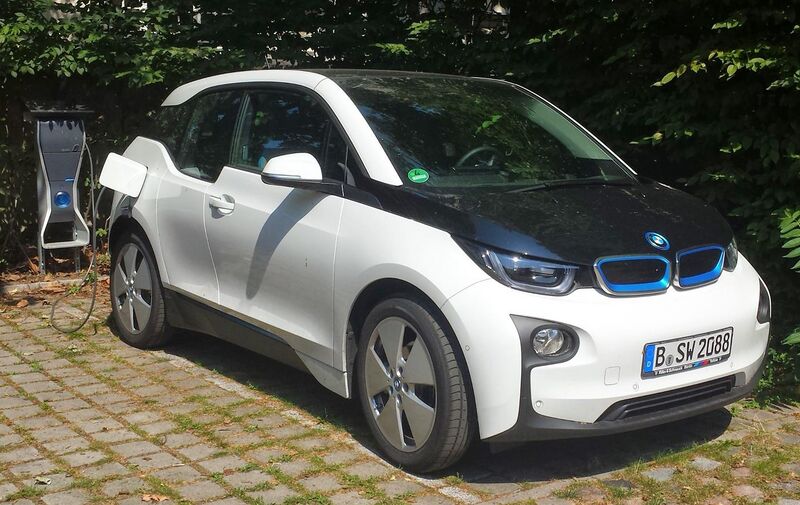 File:White BMW i3 with charging station.jpg