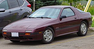 1988 Mazda RX-7 GXL in Claret Mica, Front Left, 09-10-2023.jpg