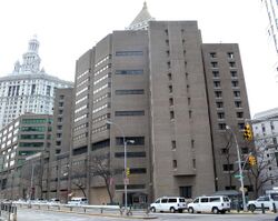 Photograph of the multi-story Metropolitan Correctional Center in New York