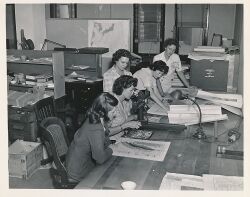 Women USGS geologists working with maps during WWII.jpg