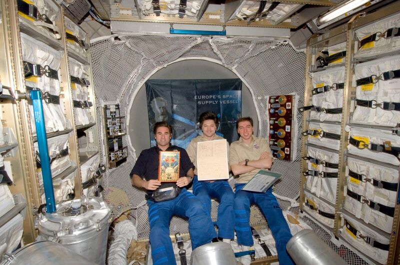 File:Crew in ATV with Jules Verne manuscript.jpg