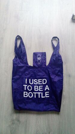 Photograph of a re-usable carrier bag made from recycled plastic bottles processed using open-loop recycling.