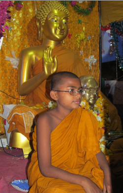 Young Indian Buddhist monk in Indian monastery.png