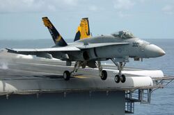 An F-A-18C Hornet launches from the flight deck of the conventionally powered aircraft carrier.jpg