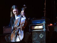 This image shows musician Don Kerr playing cello through a bass amplifier. While bass amplifiers are typically designed for the electric bass and/or the double bass, other instrumentalists use bass amps, including some electric guitarists and other instrument players.