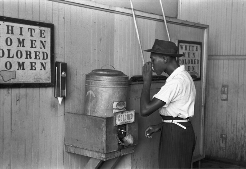 File:"Colored" drinking fountain from mid-20th century with african-american drinking.jpg