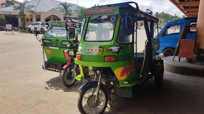 File:A tricycle (left) and a motorela (right) - Bukidnon, Philippines.jpg