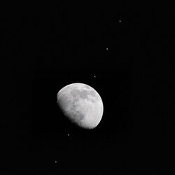 Composite of 6 photos of the ISS transiting the gibbous Moon.jpg