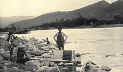 Itneg people launching spirit rafts bearing offerings for anito on a river (1922, Philippines).jpg