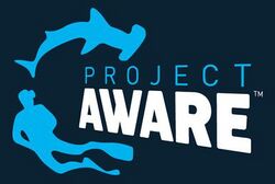 Logo: a hammerhead shark, a diver and the words "Project Aware"