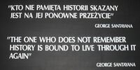 A black placard with white text reading: "KTO NIE PAMIẸTA HISTORII SKAZANY / JEST NA JEJ PONOWNE PRZEŻYCIE" / GEORGE SANTAYANA / "THE ONE WHO DOES NOT REMEMBER / HISTORY IS BOUND TO LIVE THROUGH IT / AGAIN" / GEORGE SANTAYANA