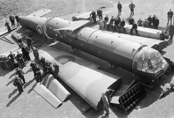 Civilian workers pose with sections of an Airspeed Horsa glider, as received from the manufacturers, before assembling it at No. 6 Maintenance Unit, Brize Norton, Oxfordshire, 26 April 1944. CH13022.jpg