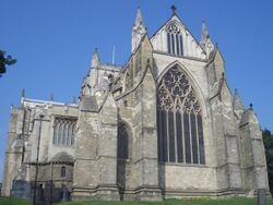 The square east end of Ripon Cathedral is defined by strongly projecting buttresses terminating in gables and pinnacles. There is a large decorated east window with tracery in a circle like the west window at Exeter.