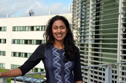 Dr. Hiranya Peiris standing outside the AlbaNova building in Stockholm Sweden.jpg