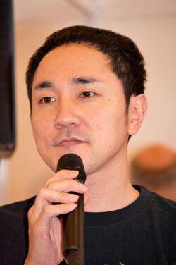 Hiroshi Matsuyama, holding a microphone