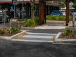 An unmarked, raised pedestrian island crossing in Brisbane, Australia