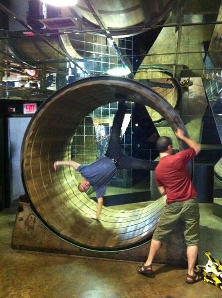 File:Brian Dunning in the giant hamster wheel at the College of Curiosity.jpg