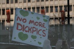 Hand-painted sign at a demonstration