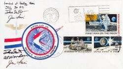 Envelope with mission patch logo, three stamps and two postmarks