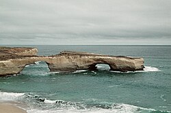 Near shore rock formation with two arches