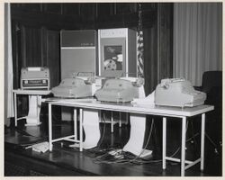 Photograph of Exhibit of PDP-4 Digital Equipment Corporation Machines on the Stage of the National Archives Auditorium, 1964 (3874706978).jpg