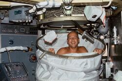 Skylab 2 Conrad in shower.jpg