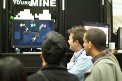 Andy Schatz displaying an early version of Monaco to onlookers at the Game Developers Conference in 2010