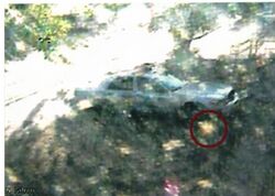 Still from Santa Fe Courthouse video; the "ghost" is circled in red..jpg