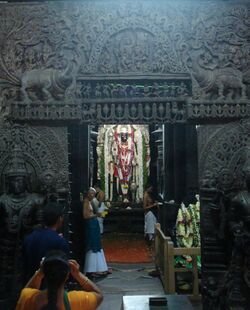 Devotees offering prayers at a sanctum in Chennakesava temple at Belur.jpg
