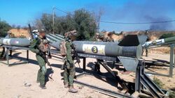 IDF soldiers near Badr-3 rockets at outpost in northern Gaza, November 2023.jpeg