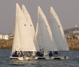 Vanguard 15 sailboats grouped on a run.png