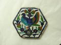 Hexagonal tile with blue bird and flowers