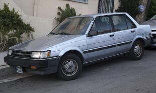 1987 Toyota Corolla LE sedan, front left.jpg