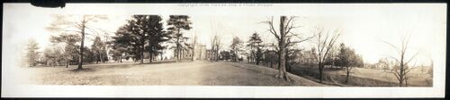 Black and white blurry photo shows Allegheny College campus in 1909 in winter with trees with no leaves
