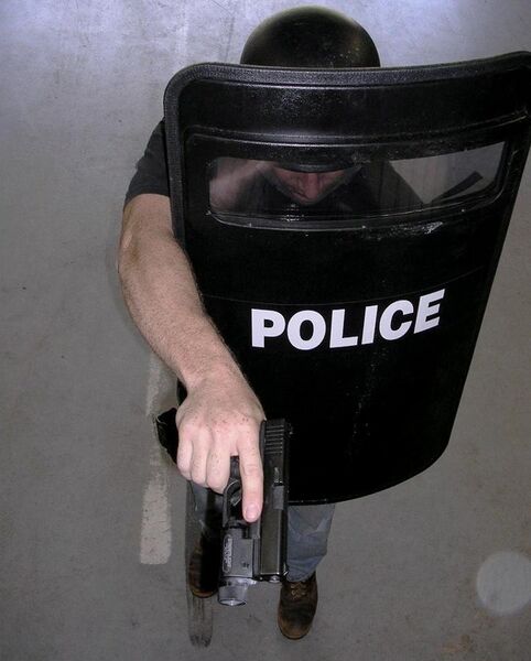 File:Police Officer with balistic shield.JPG