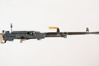 A right side view of a Soviet 7.62 mm SGM Goryunov medium machine gun with rear sight and carrying handle up.jpg